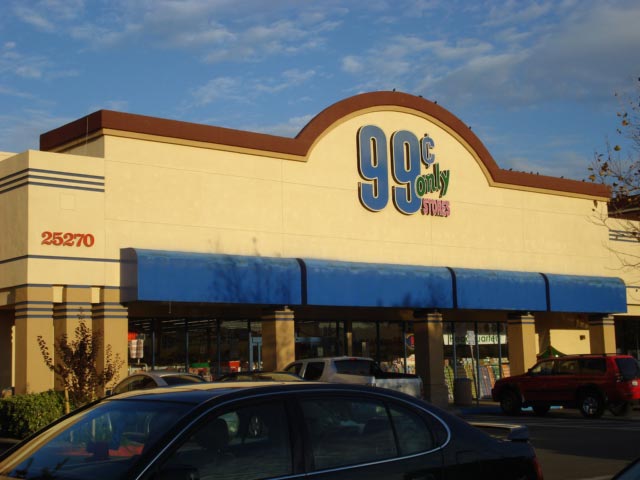 This photo shows the number 99 as part of retail signage for a 99 cent store.
